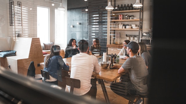 Team in a modern kitchen having a discussion